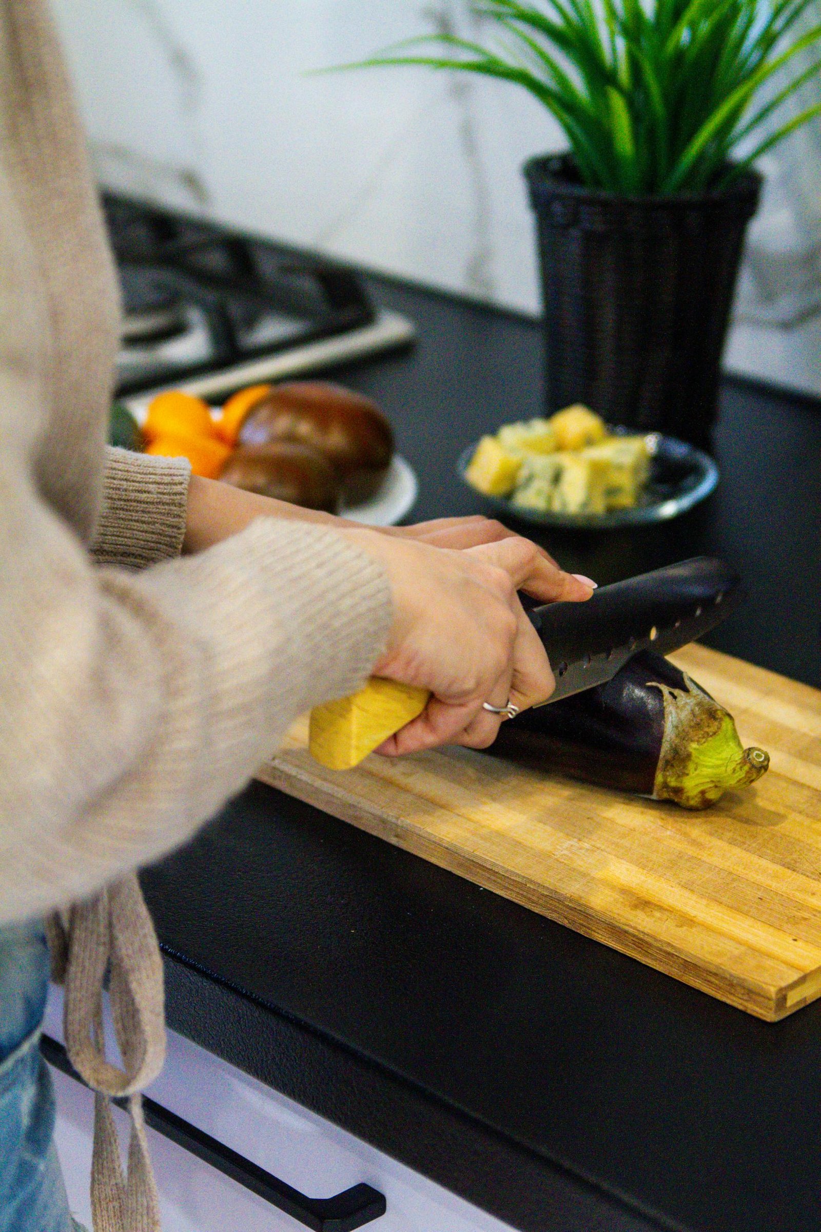 Person Slicing an Eggplant